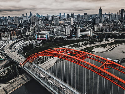 selective color photography of bridge near city thumbnail