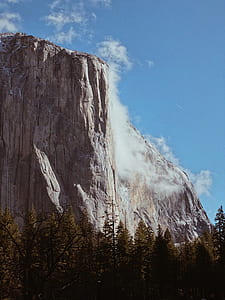 portrait photography of brown mountain and fog thumbnail