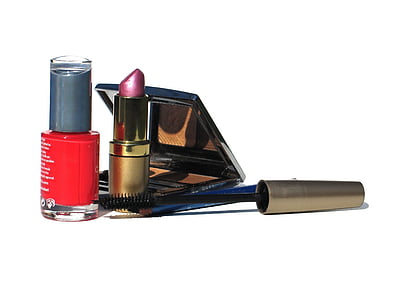 red nail polish bottle, maroon lipstick, eyeliner, and brown eyeshadow palette thumbnail