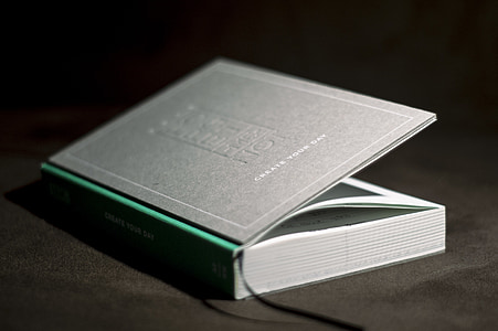 low-light photography of gray book thumbnail