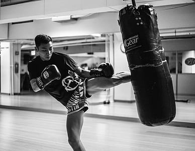 man kicking heavy bag thumbnail