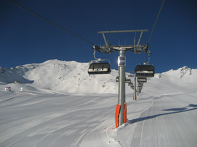 snow covered terrain and cable cars thumbnail