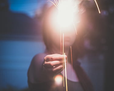 woman holding sparkler thumbnail