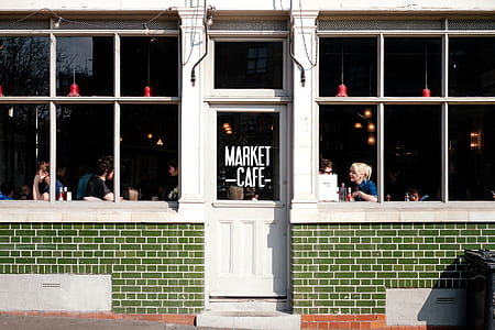 group of people sitting inside cafe during daytime thumbnail
