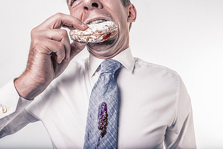 man having bite of donut thumbnail