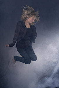 woman jumping beside fogs thumbnail
