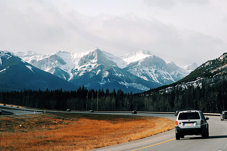 Driving on the road into the mountains in Banff National Park, Alberta, Canada thumbnail