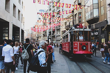 Pram Train Passing Through Building and People thumbnail