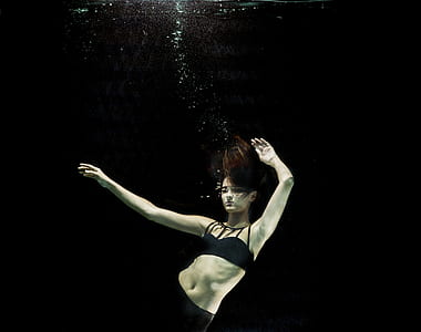 woman wearing black bikini top under water photography thumbnail