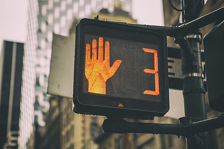 Close-up shot of the pedestrian traffic sign in Manhattan in New York City thumbnail