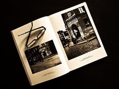 Black Framed Eyeglasses on White Photo Album thumbnail