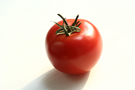 red tomato on beige surface thumbnail