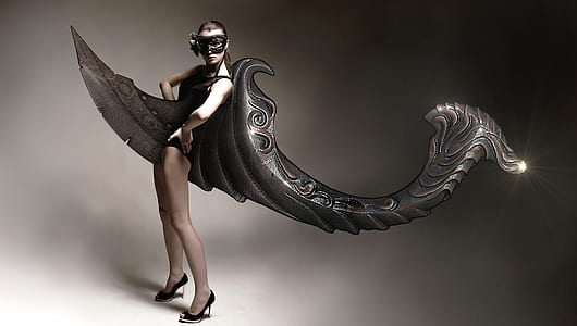 woman wearing black colombina mask thumbnail