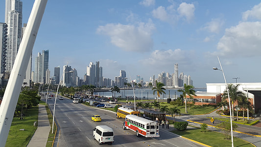 handwritten vehicles on road in distant of high rise buildings thumbnail