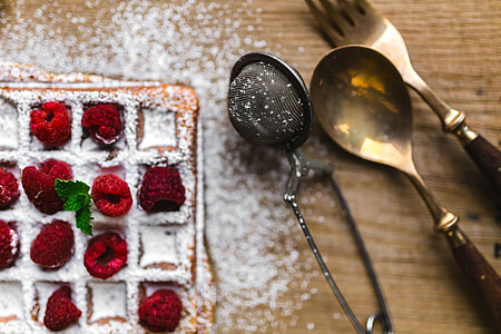 Breakfast waffles with fresh raspberries and powdered sugar thumbnail