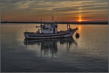 black and white fishing boat on body of water thumbnail