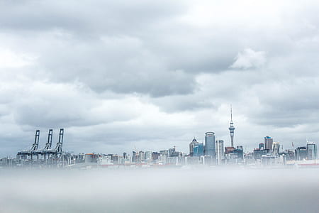 gray buildings surrounded fog thumbnail