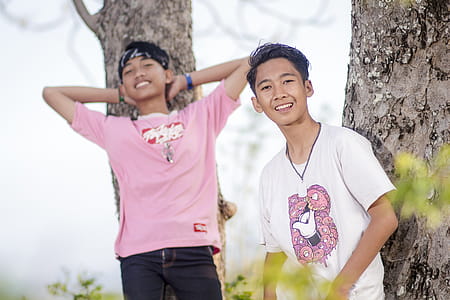 Two Boys Leaning On Trees thumbnail