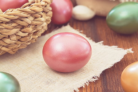 pink painted egg on burlap thumbnail