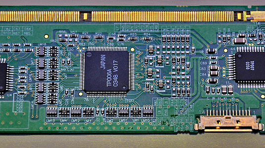 green RAM stick on brown surface thumbnail