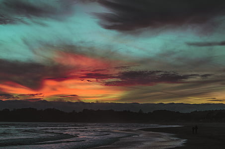 body of water under cloudy sky thumbnail