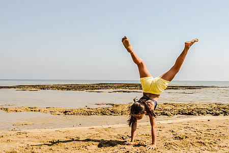 woman doing hand stand thumbnail