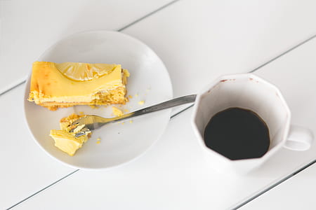 Cheesecake on plate and cup of coffee thumbnail