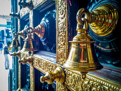 close-up photography of brass bells thumbnail