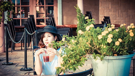 Woman Drinking Red Liquid thumbnail