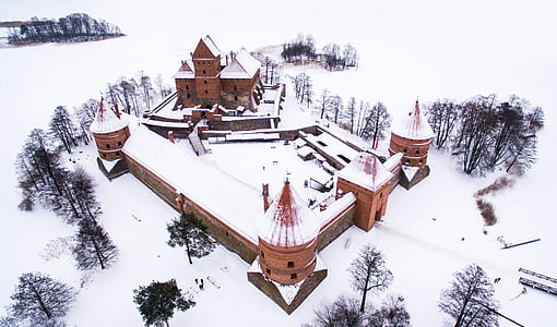 white snow-covered brown concrete building thumbnail