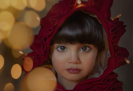 girl wearing red floral headdress in shallow focus photography thumbnail