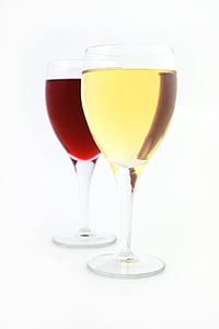 two clear drinking glasses filled with red and yellow liquids thumbnail