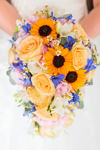 woman in white wedding dress holding flower bouquet thumbnail