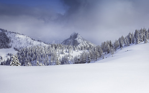 white snow on black mountain thumbnail