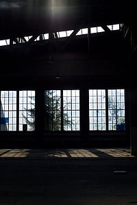 sunlight passing through glass window of dark room thumbnail
