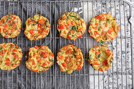 fried food with vegetables on gray grill thumbnail