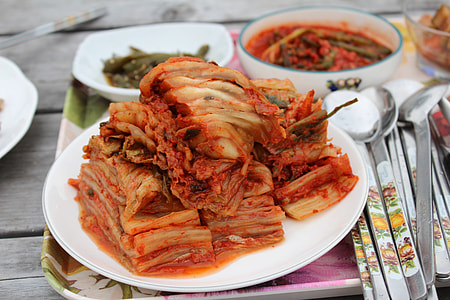 kimchi on plate beside spoon thumbnail