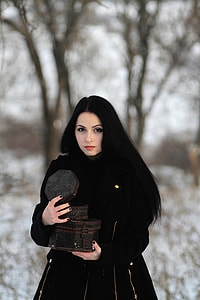 Pretty woman wearing black coat thumbnail