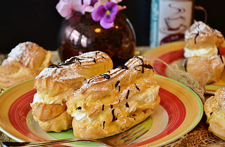 pastry on top of plate near vase thumbnail