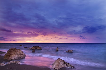photo of seashore with rock formation thumbnail
