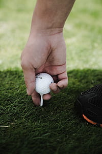 Person Holding Golf Ball thumbnail