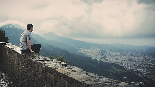 man sitting on edge thumbnail