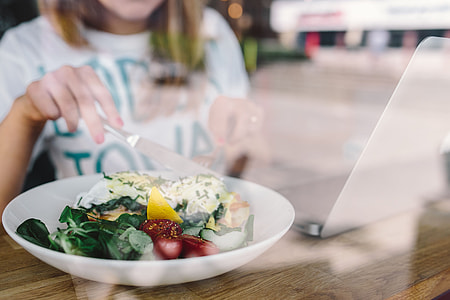 Close up image of young woman eating classic breakfast at restaurant thumbnail