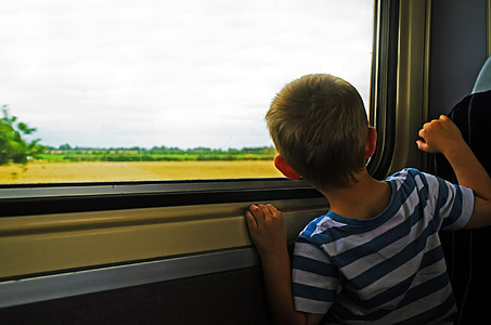 boy looking at side window thumbnail