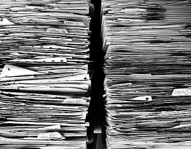 two piles of white printing papers thumbnail