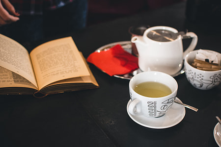 A cup of tea with a book thumbnail