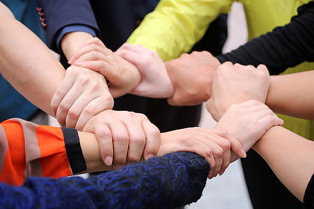 group of people holding each others wrists thumbnail