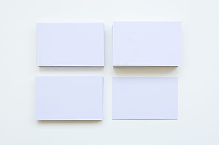 four rectangular white printer papers thumbnail