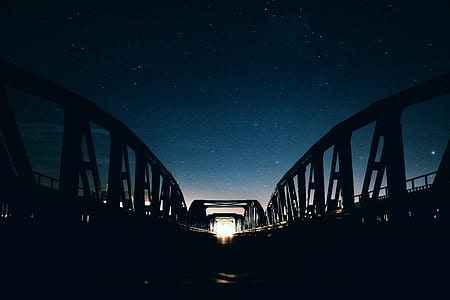 black bridge during night thumbnail