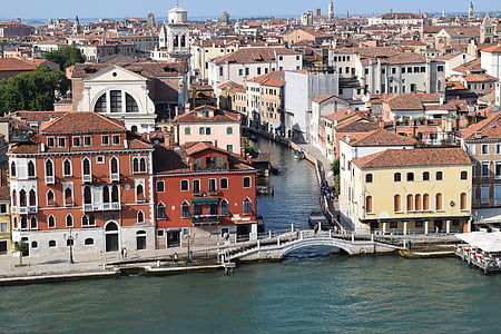 canal surrounded by buildings thumbnail